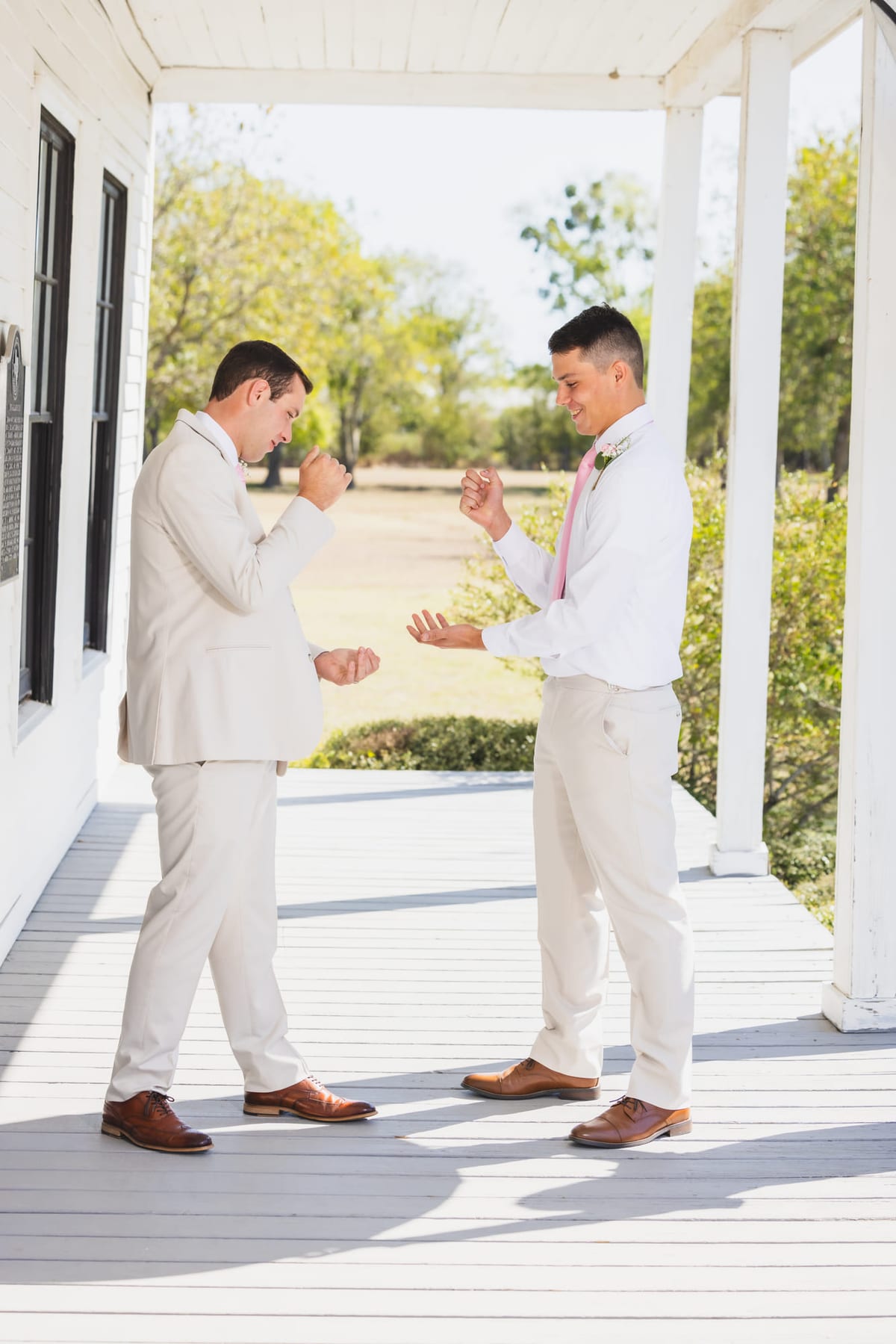 A first look on a covered porch, one turning to face the other.
